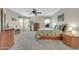 Spacious primary bedroom featuring three windows and a decorative ceiling fan at 18298 N Kari Ln, Maricopa, AZ 85139