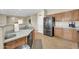 Well-lit kitchen featuring stainless steel appliances and ample cabinet space for storage at 18298 N Kari Ln, Maricopa, AZ 85139