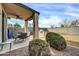Outdoor patio featuring a dining set, ceiling fan, and a built-in grill at 18298 N Kari Ln, Maricopa, AZ 85139