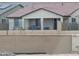 Home back exterior showcasing the covered patio, desert landscaping, and a black metal fence at 20407 W Calle Encorvada --, Buckeye, AZ 85396