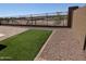 Well kept backyard with gravel, brick, and small patch of artificial turf at 20407 W Calle Encorvada --, Buckeye, AZ 85396