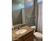 Bathroom featuring a granite vanity, a neutral-toned tile floor, and a shower-tub combination at 20407 W Calle Encorvada --, Buckeye, AZ 85396