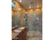 Bathroom featuring glass shower stall with double shower heads, granite countertop and sink at 20407 W Calle Encorvada --, Buckeye, AZ 85396