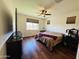 Cozy bedroom with hardwood flooring, ceiling fan, natural lighting and window coverings at 20407 W Calle Encorvada --, Buckeye, AZ 85396