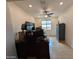 This is a spare room with neutral paint and flooring, featuring a ceiling fan and natural light at 20407 W Calle Encorvada --, Buckeye, AZ 85396