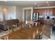 Open concept dining room flows into kitchen with stainless steel appliances and wooden cabinetry at 20407 W Calle Encorvada --, Buckeye, AZ 85396