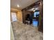 Inviting entryway featuring tile flooring, sliding barn doors, and views into the living spaces at 20407 W Calle Encorvada --, Buckeye, AZ 85396