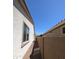 The exterior of a home with white walls, a brown roof, and a gravel side yard at 20407 W Calle Encorvada --, Buckeye, AZ 85396