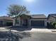 Charming single-story home with a tile roof, stone accents, and a manicured front yard at 20407 W Calle Encorvada --, Buckeye, AZ 85396