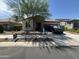 Charming single-story home featuring stone accents, desert landscaping, and an inviting entrance at 20407 W Calle Encorvada --, Buckeye, AZ 85396