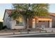 Charming single-story home with desert landscaping, a stone-accented entry, and a tile roof at 20407 W Calle Encorvada --, Buckeye, AZ 85396