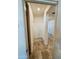 Bright hallway featuring neutral walls, tiled floor and a glimpse of other rooms at 20407 W Calle Encorvada --, Buckeye, AZ 85396