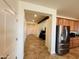 Hallway with tiled flooring leading to an open-concept kitchen, living and bedroom areas at 20407 W Calle Encorvada --, Buckeye, AZ 85396