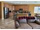 Spacious kitchen featuring granite countertops, stainless steel appliances and adjacent living area at 20407 W Calle Encorvada --, Buckeye, AZ 85396