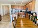 Kitchen with stainless steel appliances, wooden cabinets, granite countertops and wooden chairs around the table at 20407 W Calle Encorvada --, Buckeye, AZ 85396
