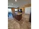 Open concept kitchen featuring a central island with granite countertop and stainless steel appliances at 20407 W Calle Encorvada --, Buckeye, AZ 85396