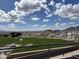 Expansive view showcasing the green landscape with unique rock formations, mountains, and blue skies at 20407 W Calle Encorvada --, Buckeye, AZ 85396