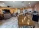 Spacious living room and kitchen combo with tile flooring, stainless steel appliances, and a dining area at 20407 W Calle Encorvada --, Buckeye, AZ 85396