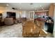 Spacious living room with tile flooring, ceiling fan, and an open floor plan into the dining room at 20407 W Calle Encorvada --, Buckeye, AZ 85396