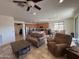 Bright and airy living room with tile flooring seamlessly connects to the kitchen and dining areas at 20407 W Calle Encorvada --, Buckeye, AZ 85396