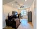 Bright office space featuring wood floors, a ceiling fan, and a large window for natural light at 20407 W Calle Encorvada --, Buckeye, AZ 85396