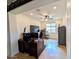 Bright office space featuring wood floors, a ceiling fan, and a large window for natural light at 20407 W Calle Encorvada --, Buckeye, AZ 85396