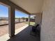 Covered patio with brick pavers, offering a shaded retreat and views of the backyard and beyond at 20407 W Calle Encorvada --, Buckeye, AZ 85396