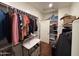 Spacious walk-in closet featuring custom shelving, hanging rods, and ample storage space for organization at 20407 W Calle Encorvada --, Buckeye, AZ 85396