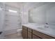 Bathroom with bathtub/shower combo, single sink, and white walls at 21291 W Edgemont Ave, Buckeye, AZ 85396