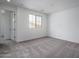 Neutral bedroom with gray carpet, mountain view, and white trim at 21291 W Edgemont Ave, Buckeye, AZ 85396