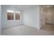 Bright flex space featuring tile floors and large windows for versatile living at 21291 W Edgemont Ave, Buckeye, AZ 85396