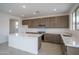 Modern kitchen with sleek countertops, stainless steel appliances, and ample cabinet space at 21291 W Edgemont Ave, Buckeye, AZ 85396