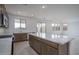 Bright, open kitchen featuring a large island, modern appliances, and plenty of counter space at 21291 W Edgemont Ave, Buckeye, AZ 85396