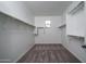 Walk-in closet with neutral carpet, white walls, and shelving at 21291 W Edgemont Ave, Buckeye, AZ 85396