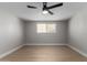 Light and airy bedroom with wood-look floors and ceiling fan at 2157 N Recker Rd, Mesa, AZ 85215
