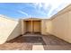 Private courtyard with a covered patio and desert landscaping in the background at 2157 N Recker Rd, Mesa, AZ 85215
