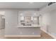 Updated kitchen features a breakfast bar and a modern appliance package for meal preparation at 2157 N Recker Rd, Mesa, AZ 85215