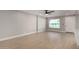 Bright, neutral living room with new floors features a large window and provides ample space to relax at 2157 N Recker Rd, Mesa, AZ 85215
