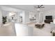 Bright, open living room with hardwood floors and modern furnishings provides a comfortable, stylish space at 2157 N Recker Rd, Mesa, AZ 85215