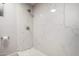 Beautiful shower with marble look tile surround and modern fixtures at 2157 N Recker Rd, Mesa, AZ 85215