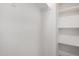 Spacious walk-in closet featuring built-in shelving and ample storage space at 2157 N Recker Rd, Mesa, AZ 85215