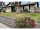 Charming single-story home with well-maintained front yard and mature tree at 230 W Goold Blvd, Avondale, AZ 85323