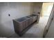 Bathroom featuring a modern vanity with dual sink, awaiting countertop installation in a new home at 29022 N 166Th Ave, Surprise, AZ 85387