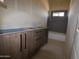 Bathroom featuring double vanity cabinet and modern fixtures under construction at 29022 N 166Th Ave, Surprise, AZ 85387