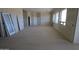 Large bedroom space with a row of windows offering plenty of natural light and French doors at 29022 N 166Th Ave, Surprise, AZ 85387