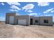 Stunning desert home with a spacious three-car garage and modern architectural details at 29022 N 166Th Ave, Surprise, AZ 85387