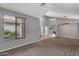 Spacious living room features high ceilings, modern lighting, and stairs leading to the second level at 3099 E Runaway Bay Pl, Chandler, AZ 85249