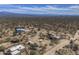 Aerial view of home with horse facilities, desert landscaping and neighborhood at 31107 N 164Th St, Scottsdale, AZ 85262