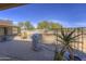 Outdoor back patio area equipped with a stainless steel grill, landscaping, and desert views at 31107 N 164Th St, Scottsdale, AZ 85262