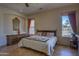 Bedroom featuring tiled floors, a ceiling fan, sitting area, and a large window with scenic views at 31107 N 164Th St, Scottsdale, AZ 85262